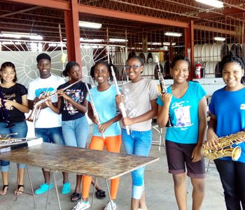 Happy Academy Members check out the Donation of brass and woodwinds for supporter is Baltimore